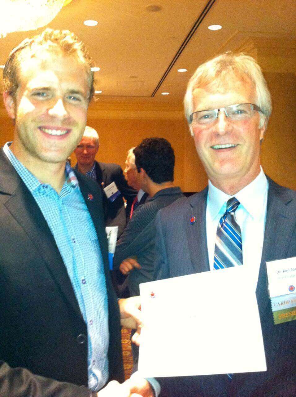 Dr. Seddon Receives his Certificate of Membership to CARDP